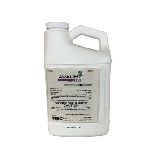 White jug and a white label with black writing against a black background.