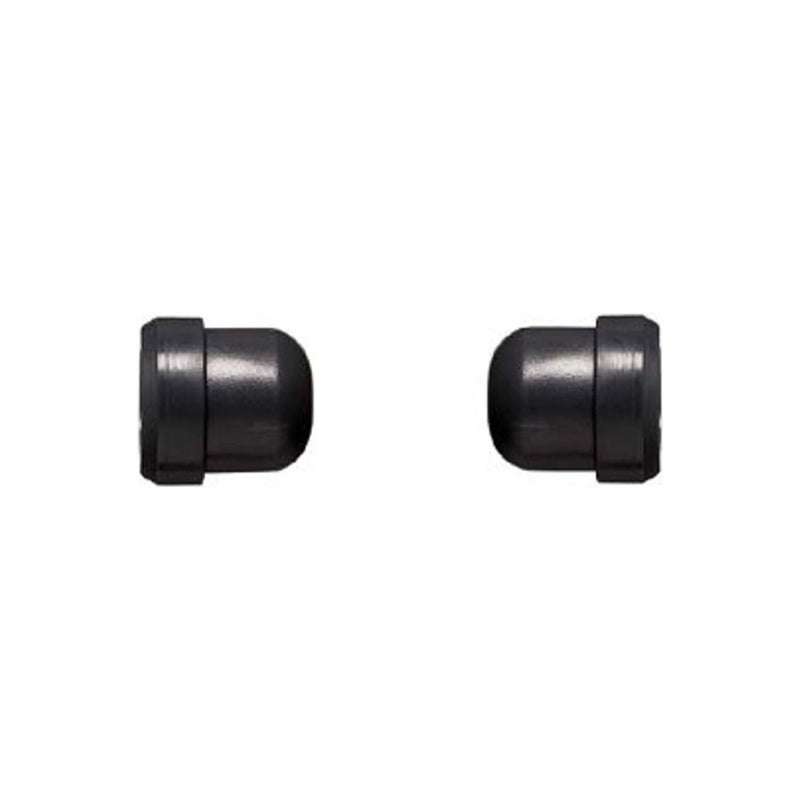 Two black rubber shock absorbers on a white background