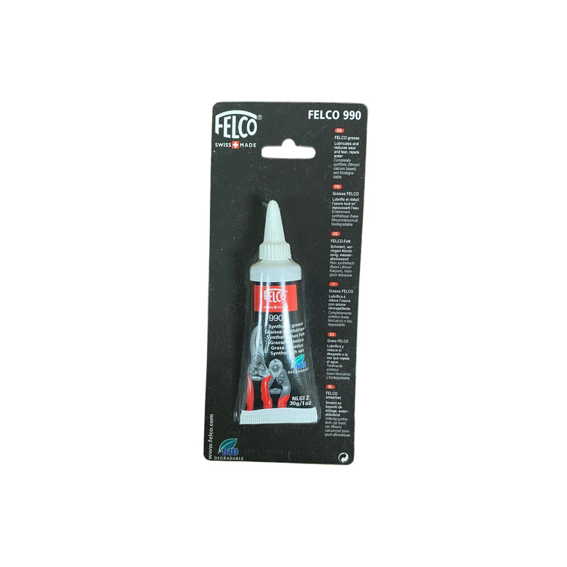 a black tube of Felco 990 grease attached to black packaging on a white background