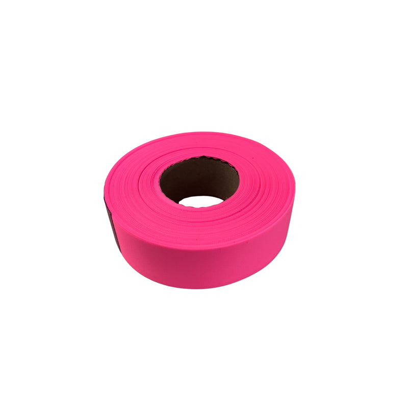 Pink roll of tape on a white background