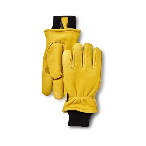 Two tan gloves with black cuffs against a white background