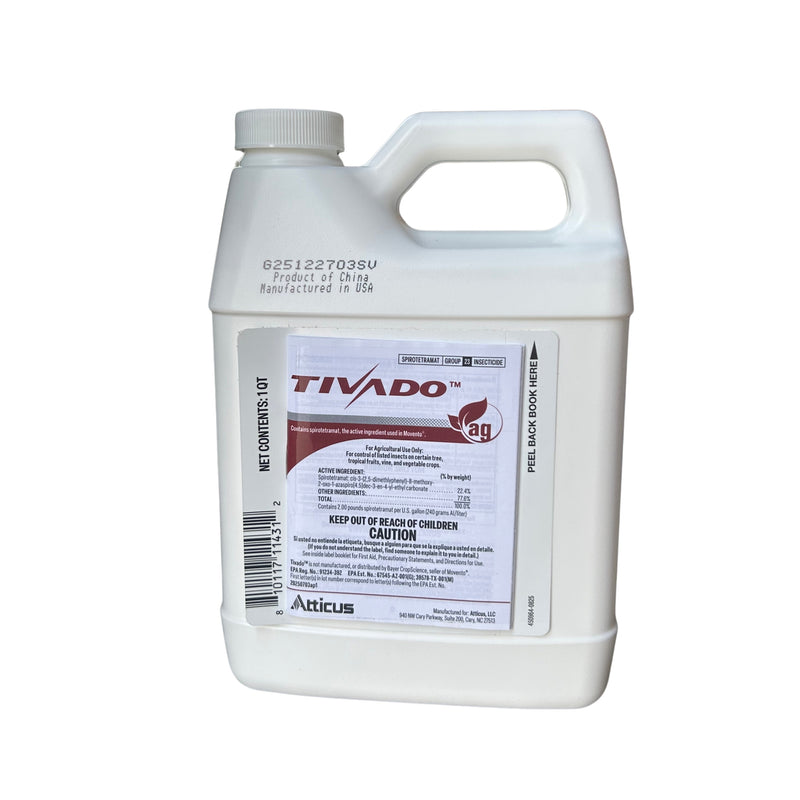 A white jug with a red and black label against a white background